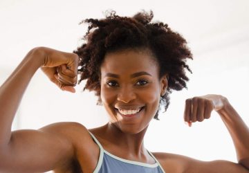 woman posing while flexing her muscles