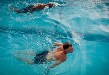 man swimming in a pool
