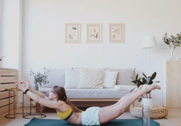 a woman doing yoga at home
