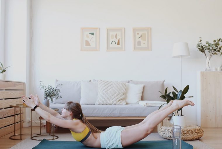 a woman doing yoga at home