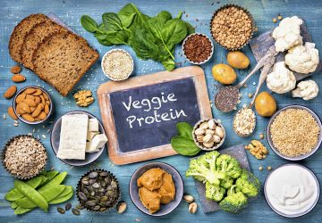 Vegan protein sources. Top view on a blue wooden background