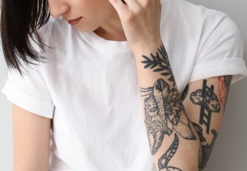 a woman with an arm tattoo
