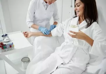 a woman receiving IV therapy